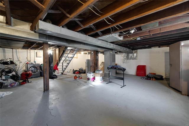 unfinished basement featuring stairs and water heater