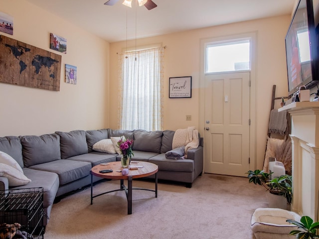 living room featuring ceiling fan and light carpet