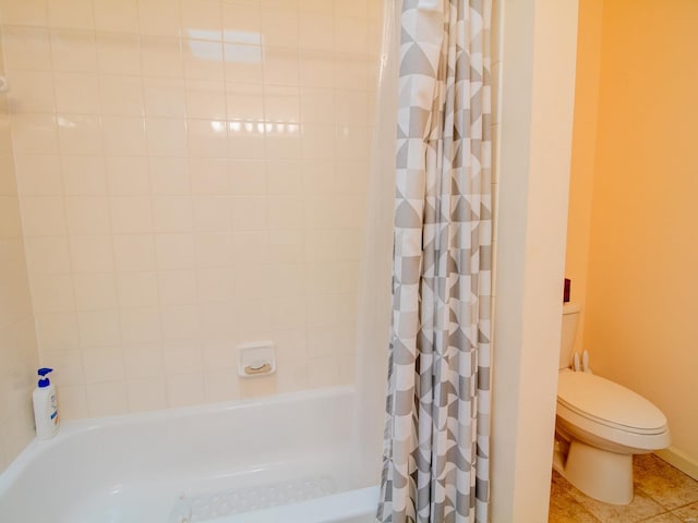 full bath featuring toilet, shower / bath combo, and tile patterned floors