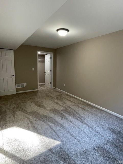 unfurnished bedroom with carpet flooring and a closet