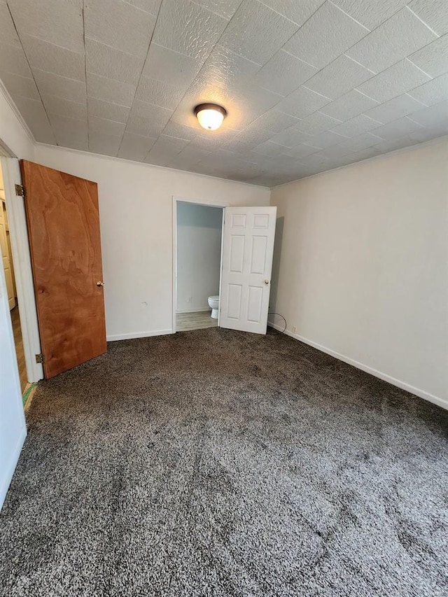 unfurnished bedroom with carpet flooring