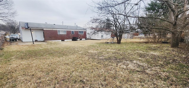 view of yard with central AC