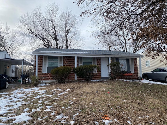 view of front of home with a carport