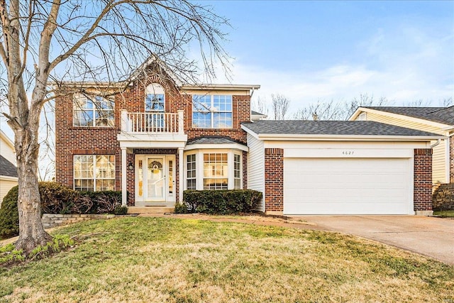 view of front facade featuring a balcony, a garage, brick siding, driveway, and a front yard