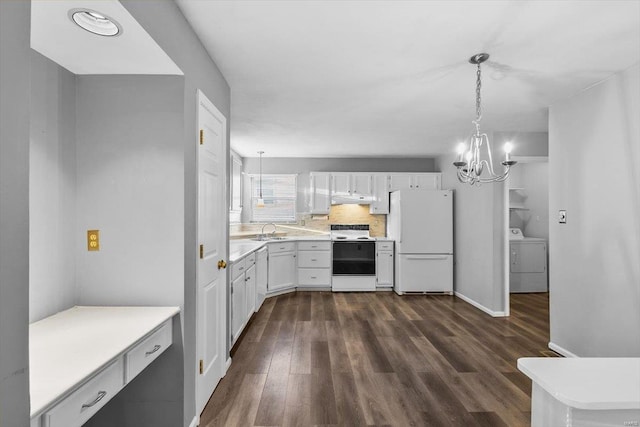 kitchen featuring dark wood finished floors, light countertops, an inviting chandelier, washer / dryer, and white appliances