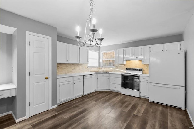 kitchen featuring white appliances, dark wood-style floors, white cabinetry, and light countertops