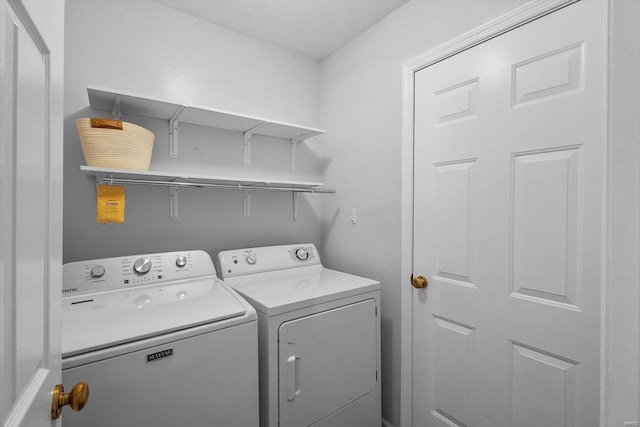 laundry room featuring laundry area and washing machine and clothes dryer