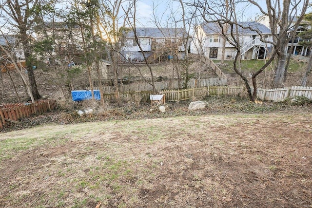 view of yard with fence and a residential view