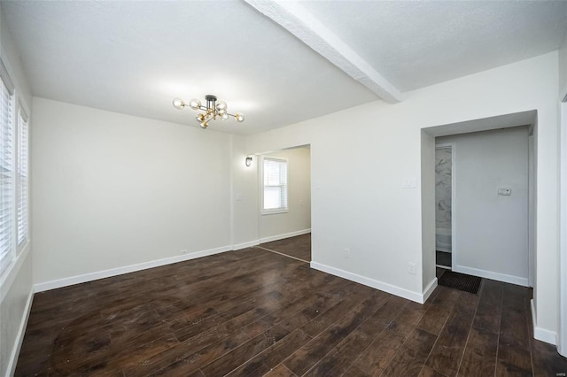 unfurnished room with a chandelier, dark wood-type flooring, beam ceiling, and baseboards