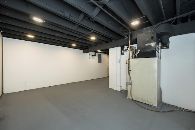 finished basement featuring heating unit