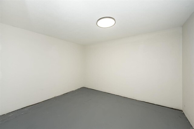 empty room featuring finished concrete flooring