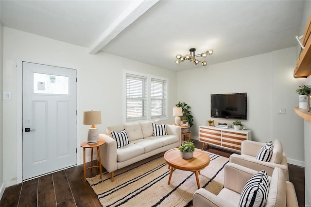 living area featuring an inviting chandelier, beam ceiling, baseboards, and dark wood-type flooring