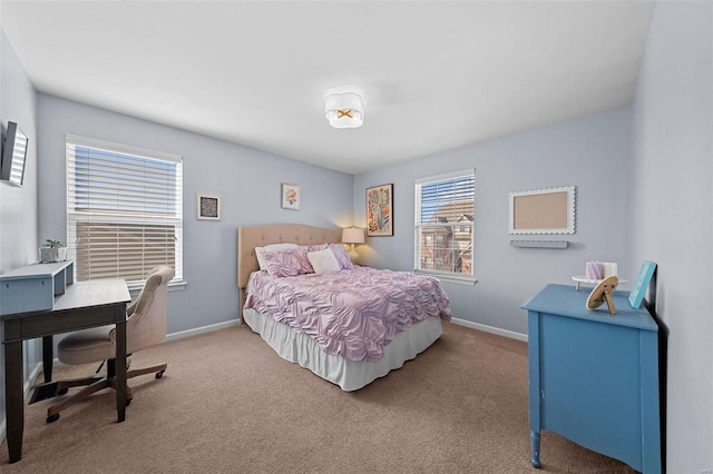 carpeted bedroom with baseboards