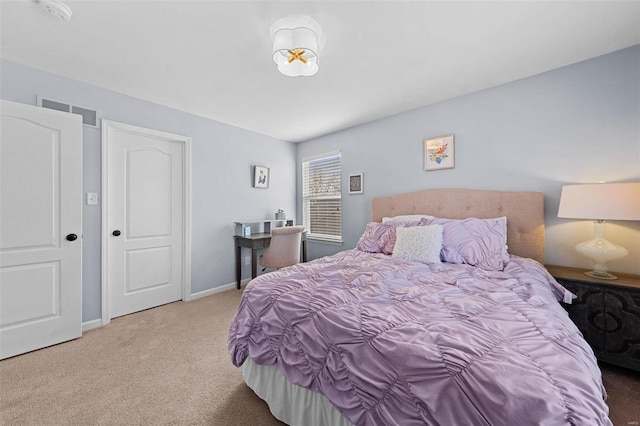 bedroom featuring carpet flooring, visible vents, and baseboards