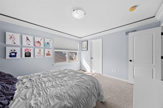 carpeted bedroom featuring visible vents, crown molding, and baseboards