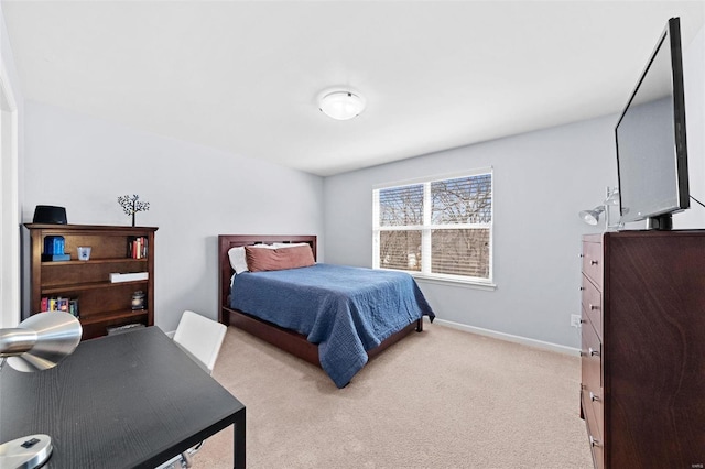 bedroom featuring carpet floors and baseboards