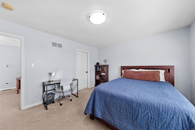 bedroom with light carpet, visible vents, and baseboards