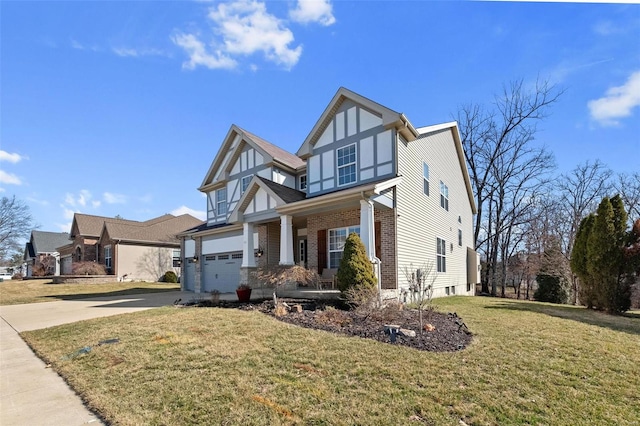 english style home with a front lawn, brick siding, driveway, and an attached garage