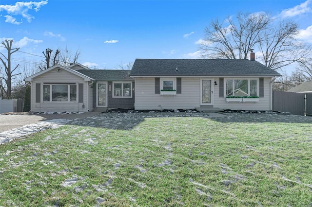 single story home with a front lawn