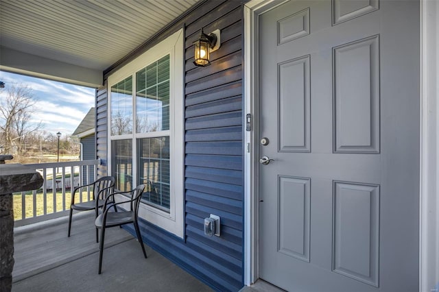 doorway to property featuring covered porch