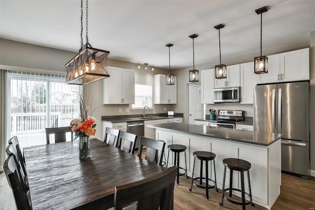 dining space with dark wood finished floors