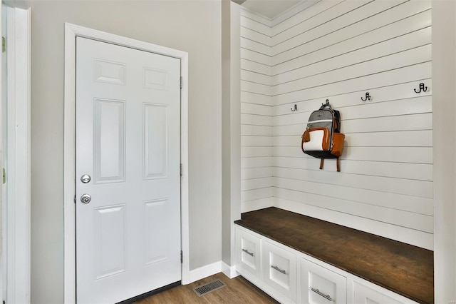 mudroom with visible vents and dark wood finished floors