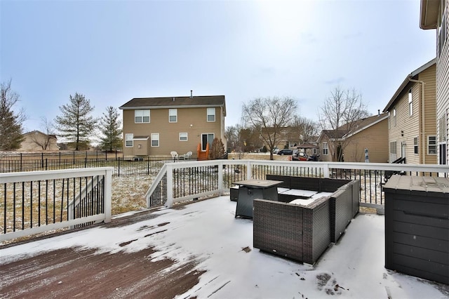 wooden terrace with a residential view, a fenced backyard, and an outdoor fire pit