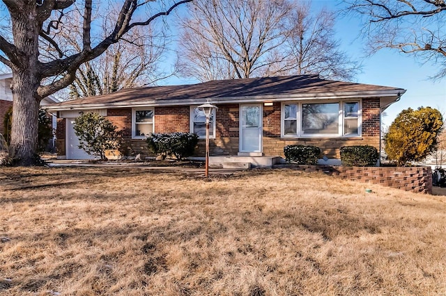 ranch-style house with a front lawn