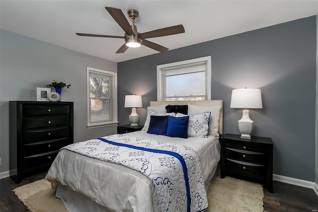 bedroom featuring dark hardwood / wood-style floors and ceiling fan