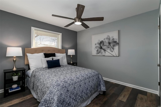 bedroom featuring dark wood-type flooring and ceiling fan