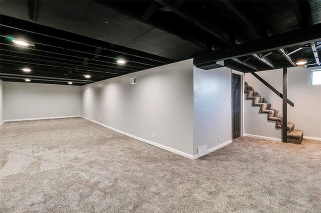 basement with carpet flooring