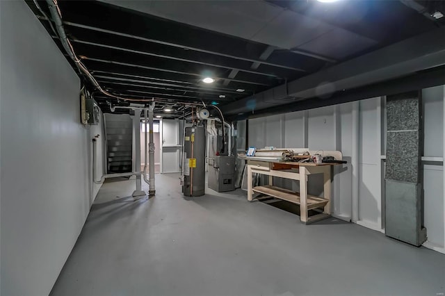 basement featuring water heater and heating unit