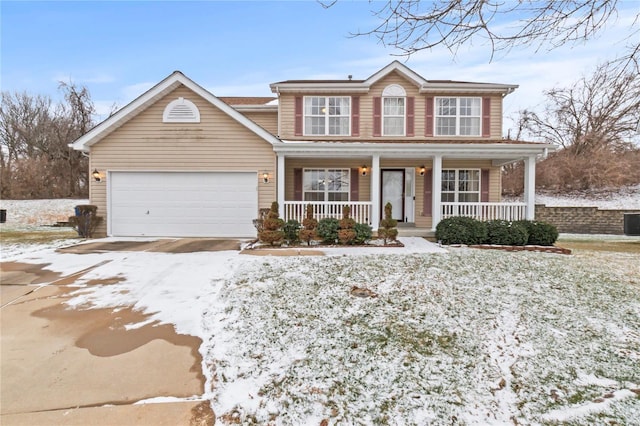 view of front of home with covered porch and a garage