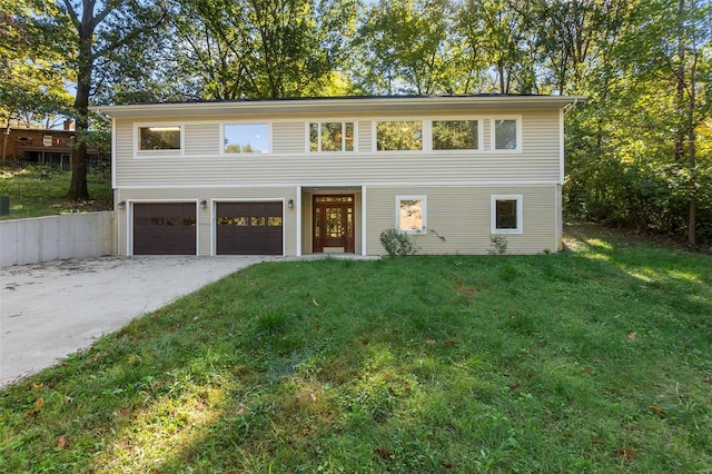 view of front of home with a garage and a front yard