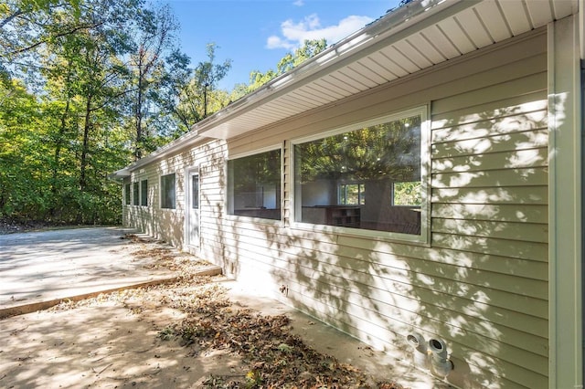 view of side of home with a patio area