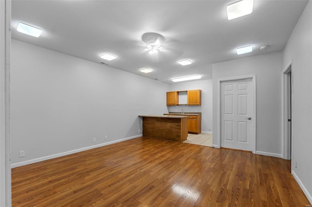 interior space featuring light hardwood / wood-style flooring and kitchen peninsula