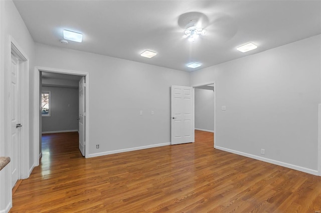 unfurnished room with wood-type flooring