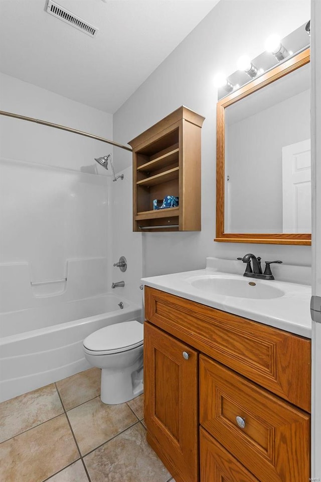 full bathroom featuring  shower combination, vanity, tile patterned floors, and toilet