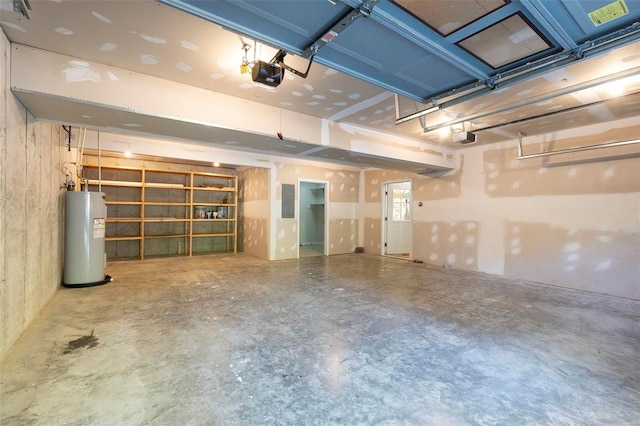 garage featuring a garage door opener and water heater