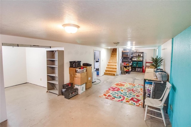 basement featuring a textured ceiling