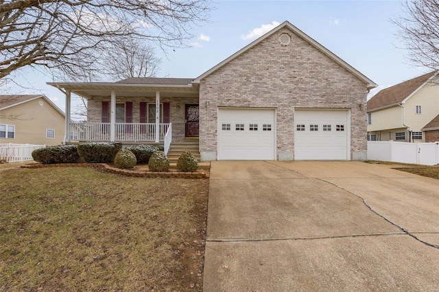 ranch-style house with a garage, a front yard, and covered porch