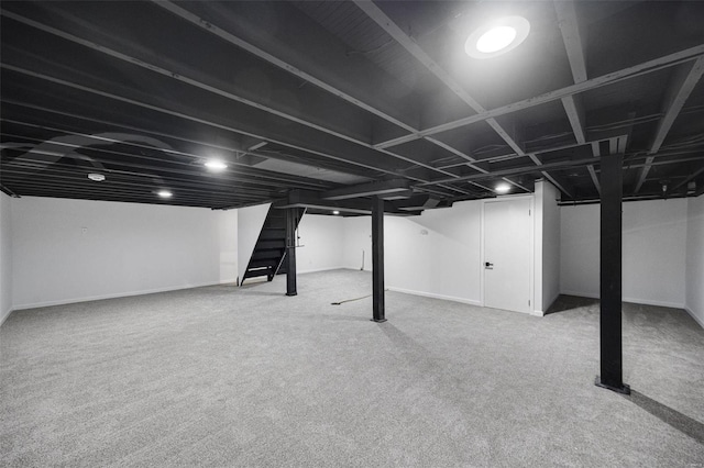 finished basement featuring carpet floors and baseboards