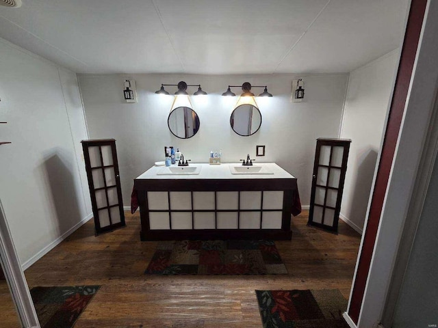 bathroom featuring vanity and hardwood / wood-style flooring