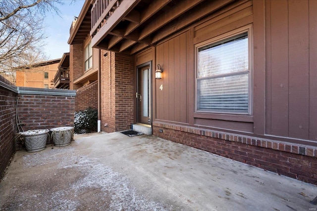 property entrance with a patio area