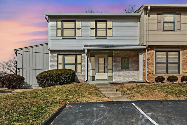 view of property featuring brick siding