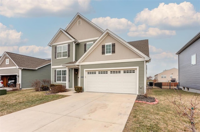 view of front of house with fence, a front lawn, and concrete driveway