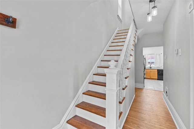 stairs with wood-type flooring