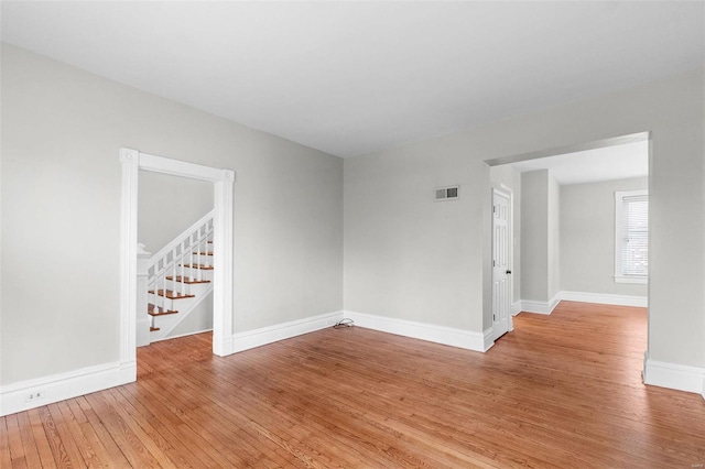 spare room featuring light hardwood / wood-style floors