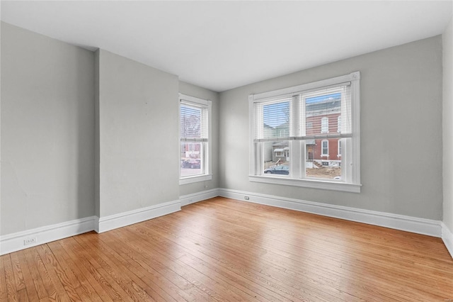 unfurnished room with light hardwood / wood-style flooring