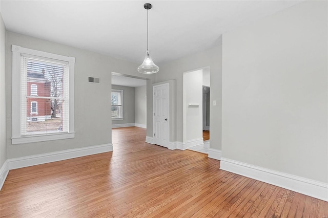 unfurnished dining area with light wood-type flooring